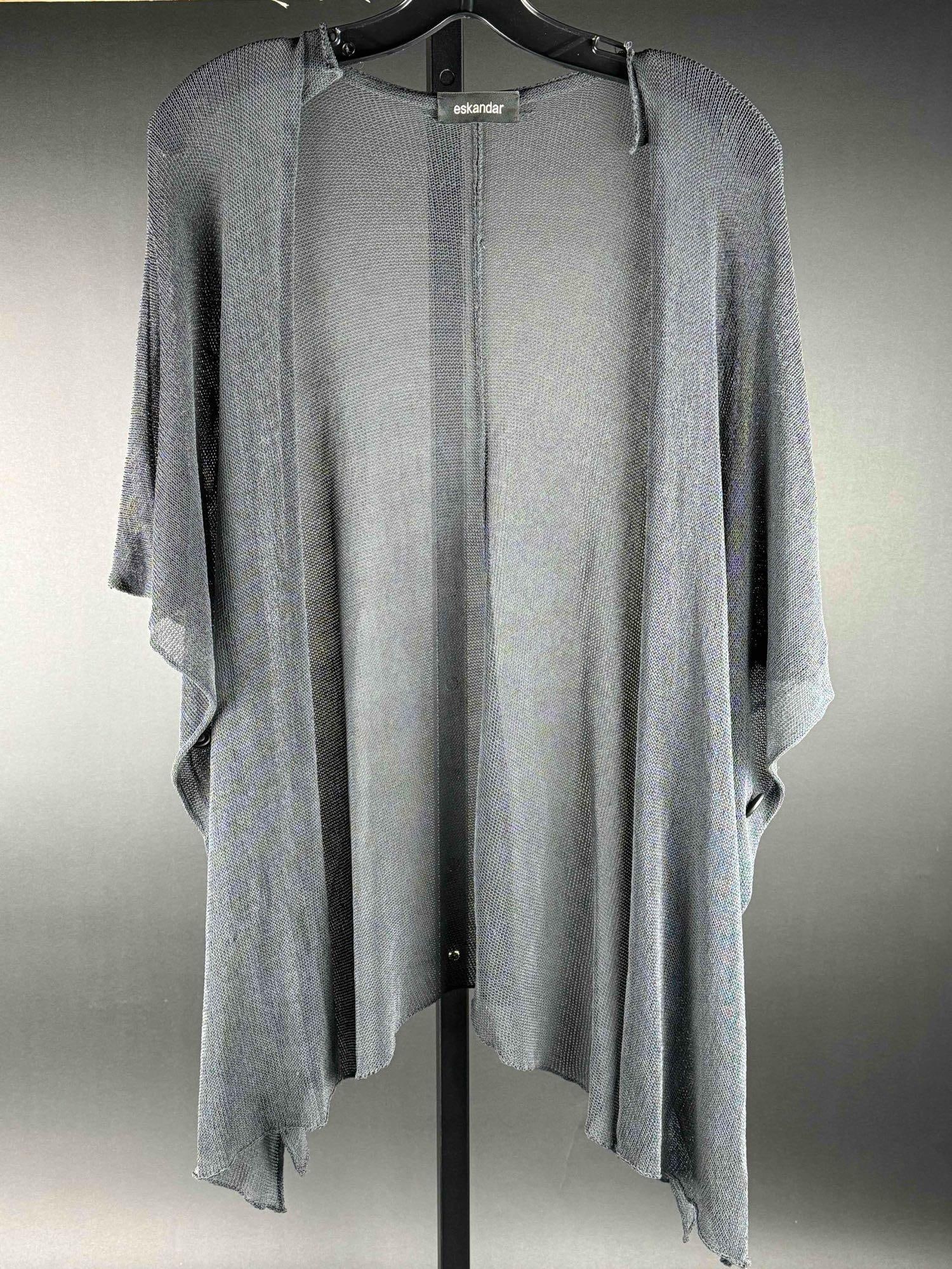 Eskandar Open Cardigan: Vintage Eskandar open mesh woven cardigan with button detailing. Buttons can be undone to convert this piece into a wrap. In excellent condition. Please see photos for additional details. Dimensions: 