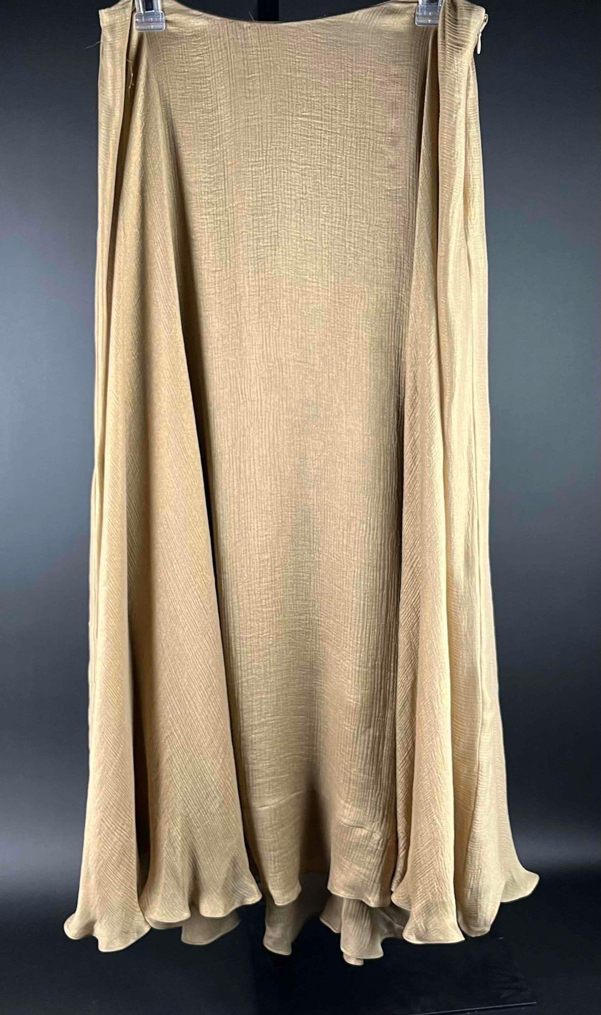 Ralph Lauren Long Skirt (NWT): Ralph Lauren gold long skirt made of 100% silk. Mid-calf, flounce skirt with holiday sheen. Original tags are still attached. Made in China. In excellent condition. Please see photos for additional de