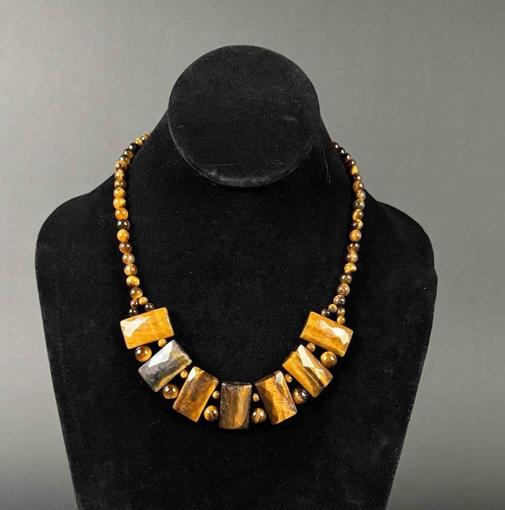 African Tigers Eye Beaded Necklace: Beaded rectangular necklace made with tigers eye and stainless steel metal clasp ( lobster claw ). In excellent condition. Please see photos for additional details. Dimensions: 18 " - 20 " Ple