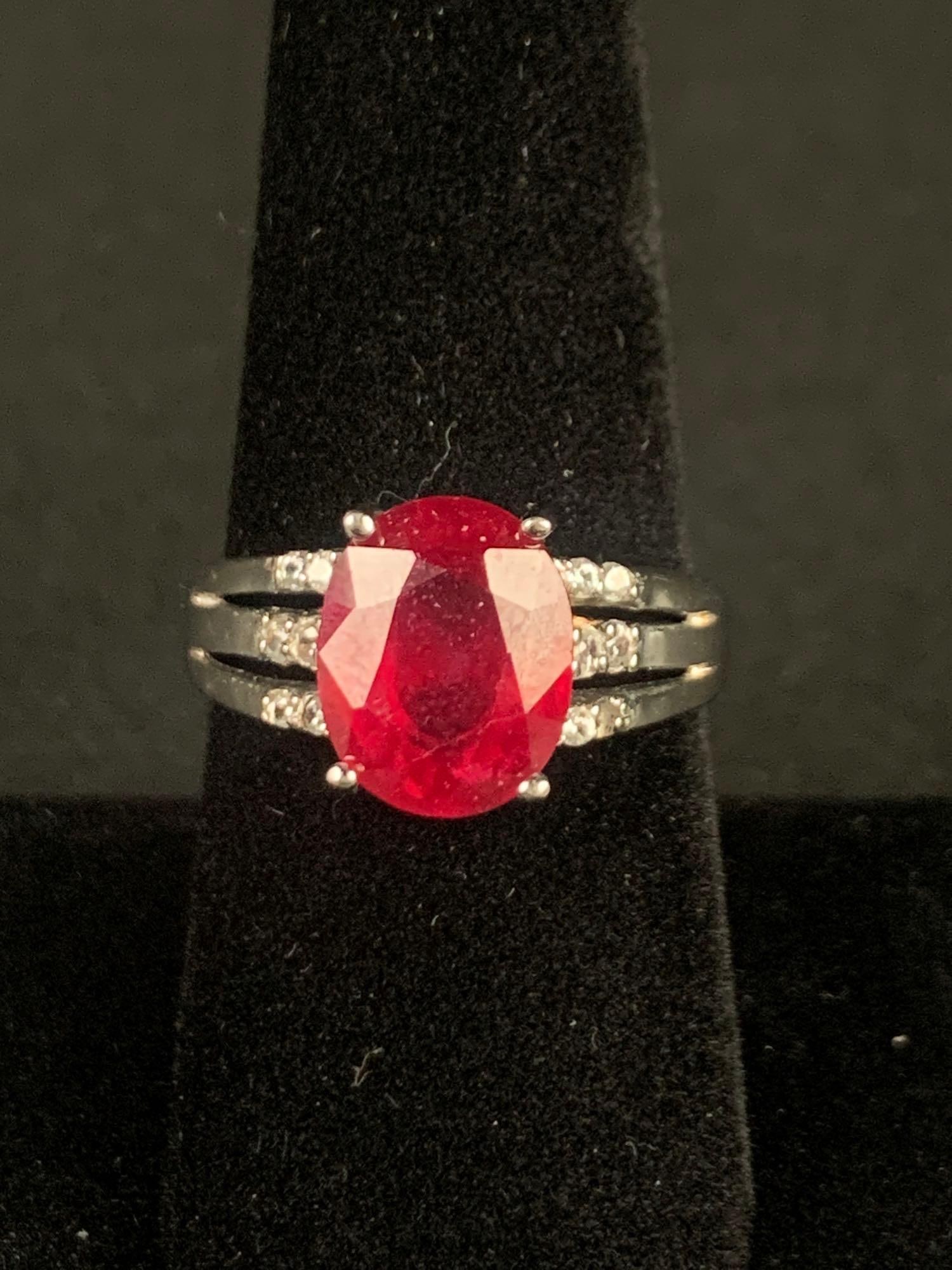 Nissa Ruby and Zirconia Ring (Platinum Over Sterling): Sterling silver ruby ring. Ring is size 9 and weighs 5.20 grams. Ring is in excellent condition. Please refer to photos for further details. Please note all lots show signs of wear commensurate with a
