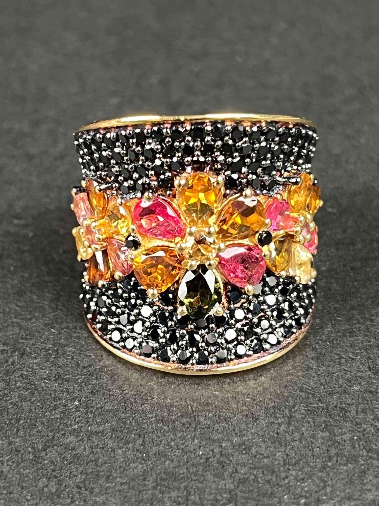 Multi Tourmaline and Natural Black Spinel Ring: Rhodium and vermeil yellow gold over Sterling Silver ring with multi-colored tourmaline and natural black spinel stones. Ring weighs 9.6 grams and is 6.40 CTW. In excellent condition. Please refer to 