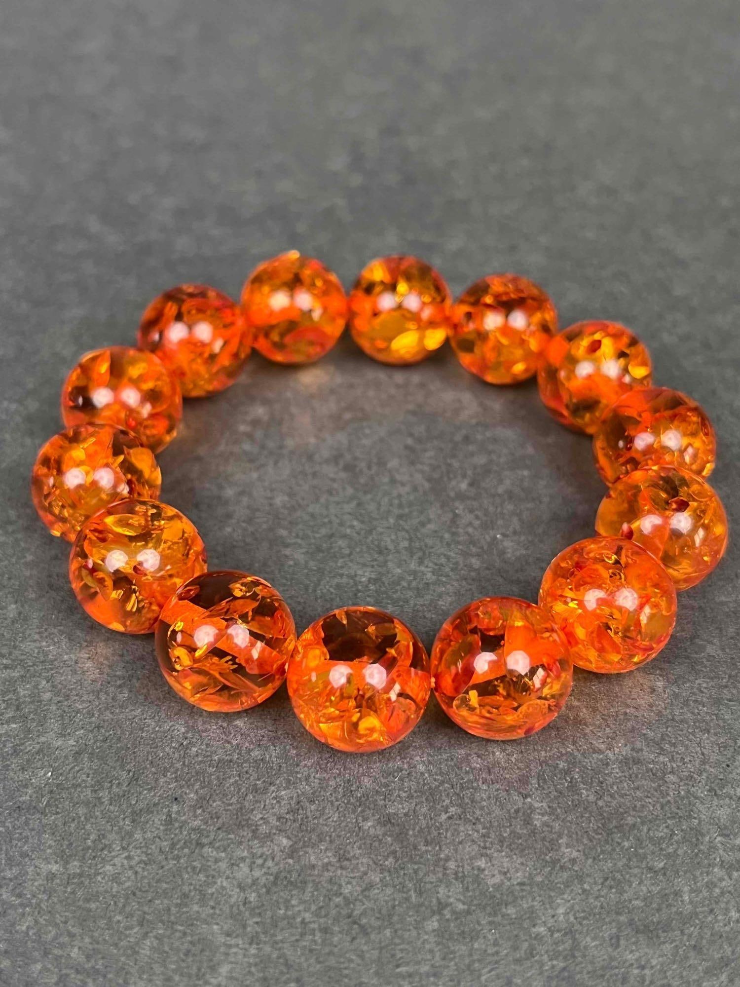 Baltic Amber Bracelet: Grade AAA Baltic Amber Bracelet. Bracelet is in excellent condition. Please refer to photos for further details. 23.94g. Dimensions: 3" diameter Beads are 14mm Please note all lots show signs of w