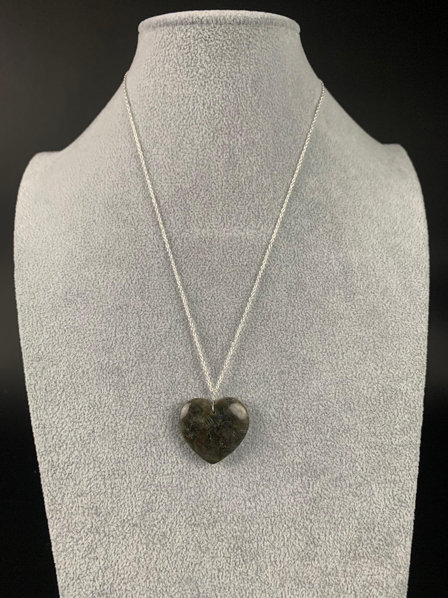 Heart Shaped Labradorite Sterling Silver Necklace: Heart shaped labradorite sterling silver necklace. Necklace is 20" and comes out to 50.00 CTW. Necklace is in excellent condition. Please refer to photos for further details. Please note all lo