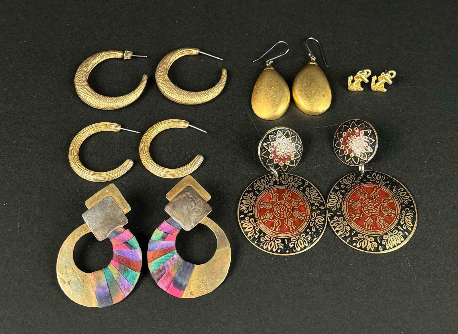 Lot of Vintage Earrings: Earrings ranging from hoops, studs, and dangles. All in good condition. Please see photos for additional details. Please note all lots show signs of wear commensurate with age and use, and the lack of