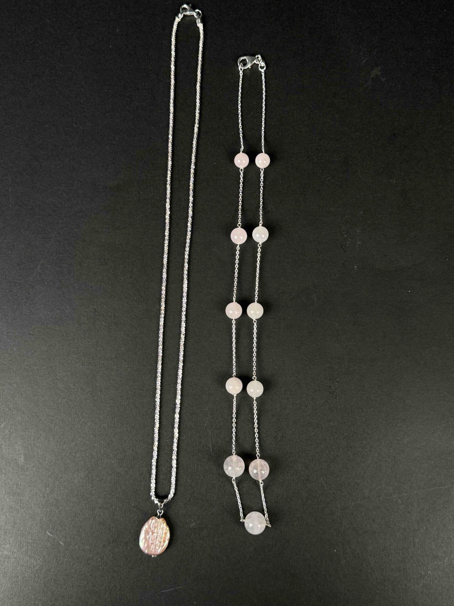 2 Sterling Silver Necklaces: 2 sterling silver keshi pearl and morganite necklaces. Necklaces come in at a total weight of 19.20 grams. Both necklaces are in excellent condition. Please refer to photos for further details. Ple
