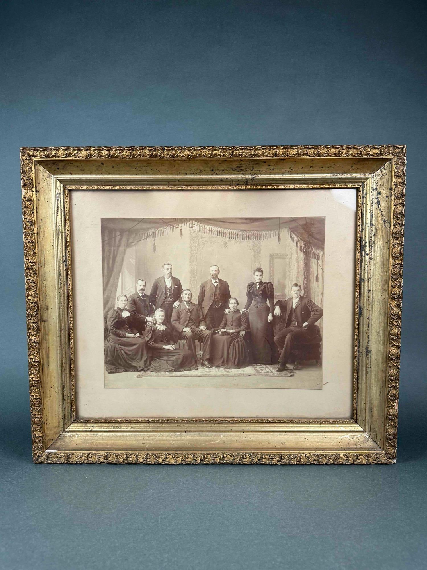 Antique Family Portrait W/ Gold Wooden Frame: Antique family photo (Circa 19th century). No date of when photo was taken. Frame is made of wood that is painted gold. In good condition. Please see photo for additional details. Dimensions: 23" 
