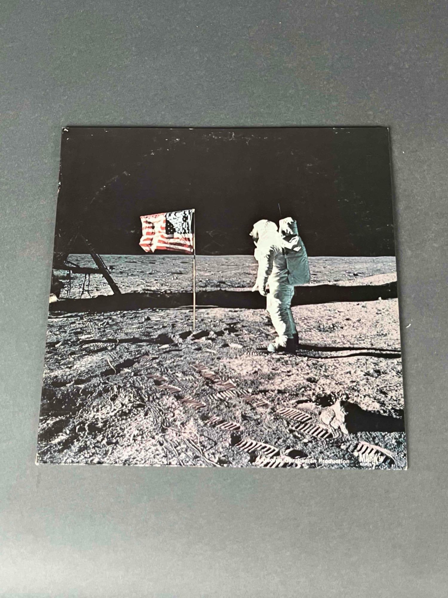 Classic "First Man on the Moon" Documentary Record: 1 "First Man on the Moon" documentary record. Record is in good used condition. Album cover shows signs of wear commensurate with age. Please see photos for additional details. | Please note a