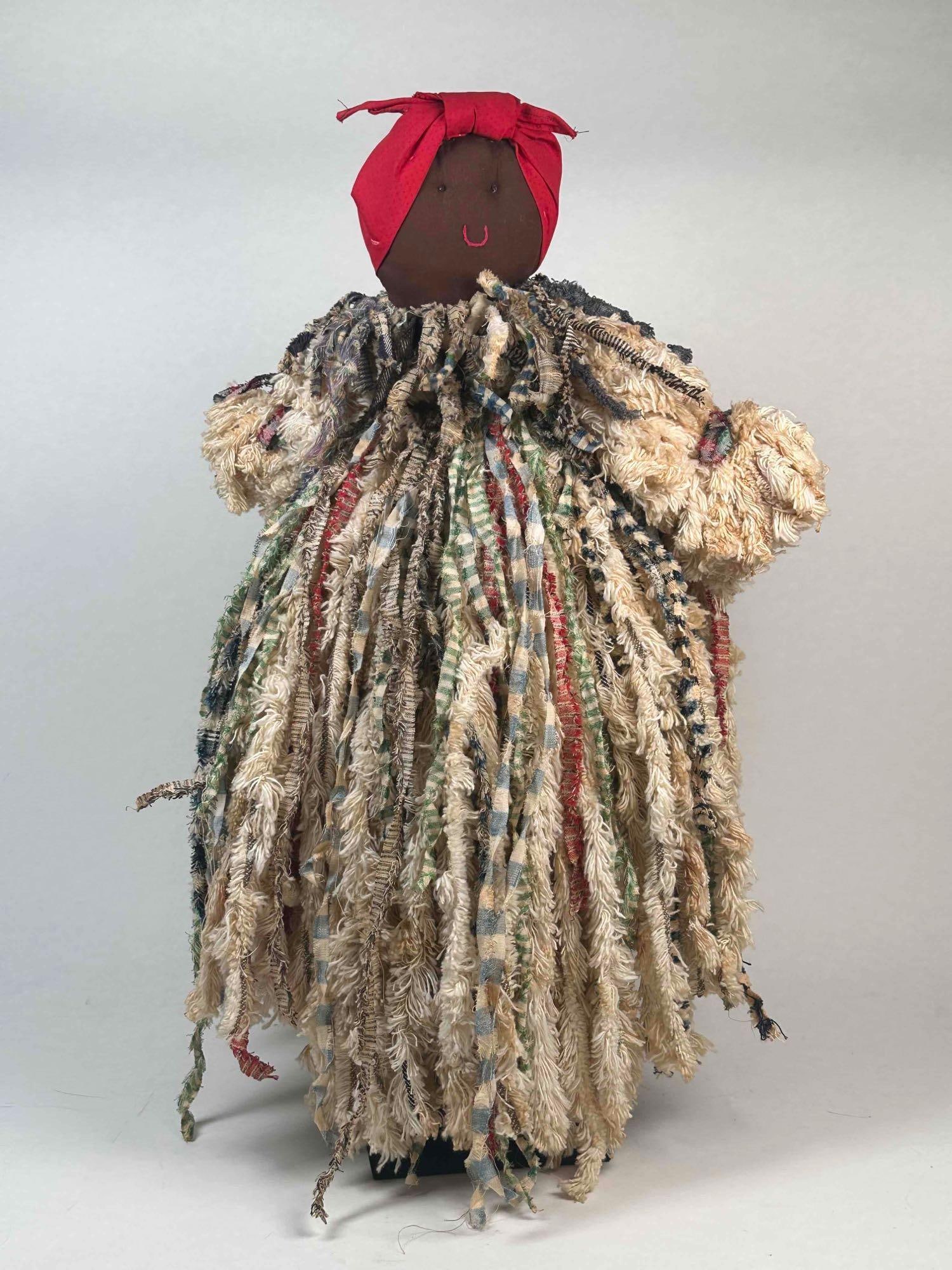 Haitian Folk Art Rag Doll: Haitian Folk Art Rag Doll. Caribbean black multi-texture doll made in Haiti. Frayed rags are part of the original make. The doll is in excellent condition. Please refer to photos for further details. 