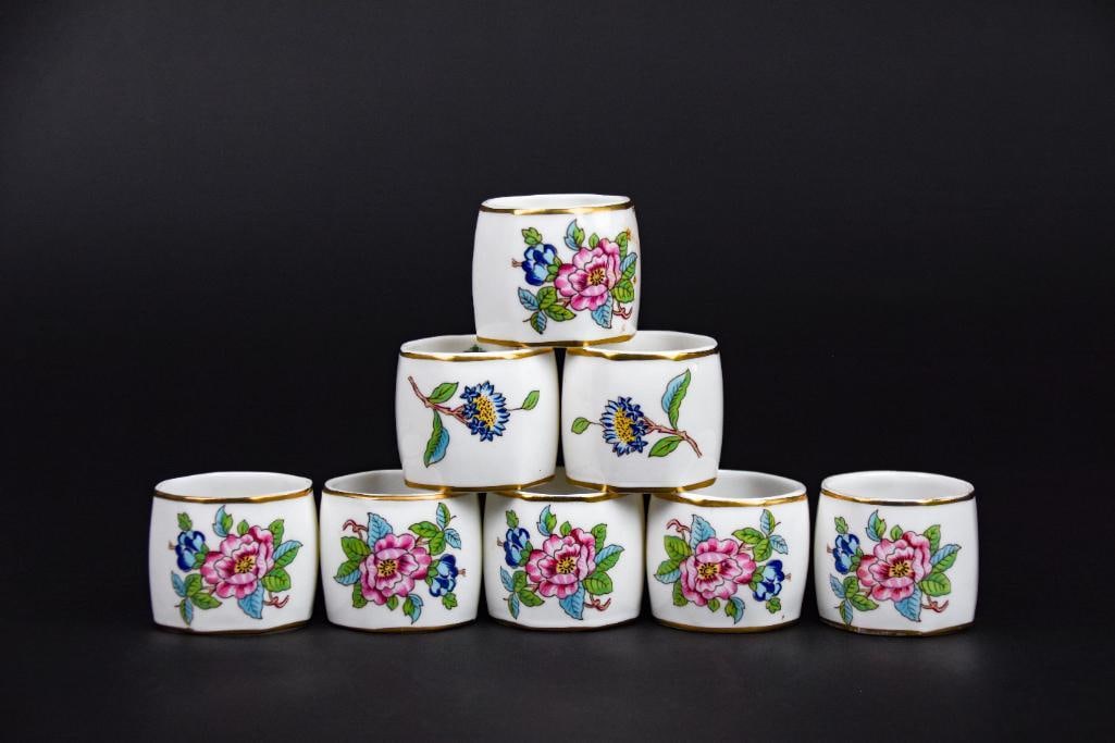 8 Aynsley Bone China Napkin Holders: 8 Aynsley fine bone china napkin rings with gold trim. Made in England circa late 1930's. All are in excellent condition. Please see photos for additional details. Dimensions: 1 1/2" x 1 1/2
