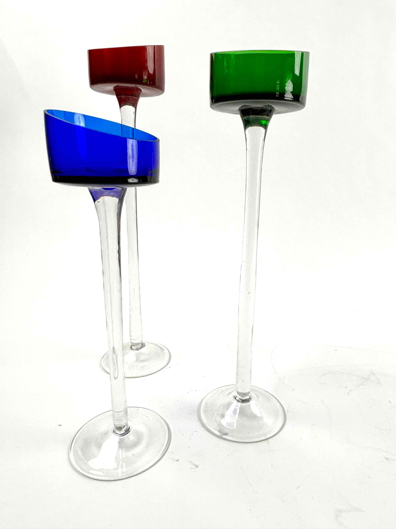 Modern Votive Candlesticks: Modern glass votive candlesticks. Excellent condition. Please see photos for additional details. Dimensions Green: 11" tall Dimensions Red: 12" tall Dimensions Blue: 9" tall Weight: 1 lb