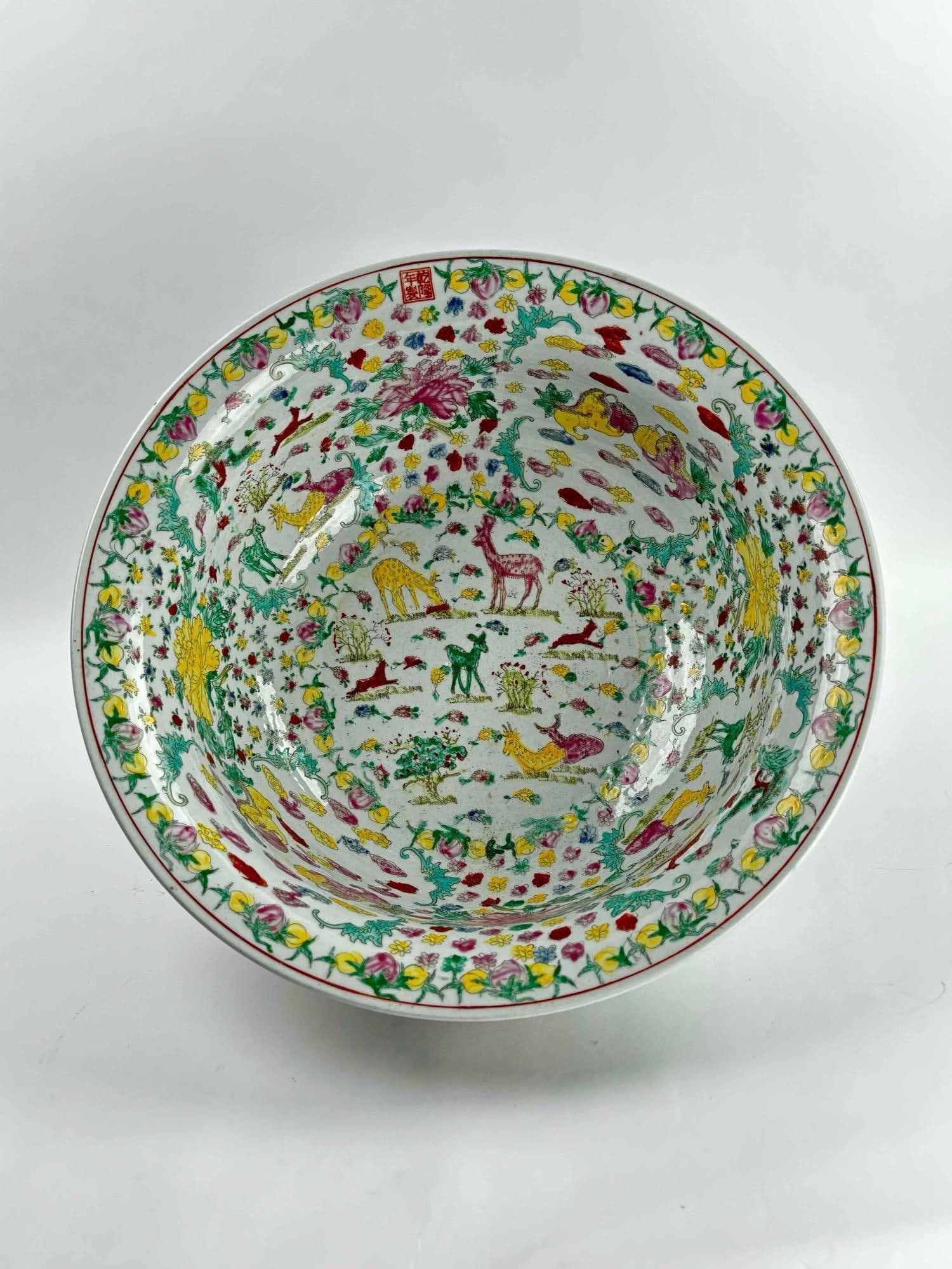 Large Qianlong Porcelain Bowl: Chinese Antique Porcelain bowl with Qianlong Seal. Excellent condition. Please see photos for additional details. Dimensions: 16" x 16" x 7" Weight: 12 lbs Please note all lots show signs