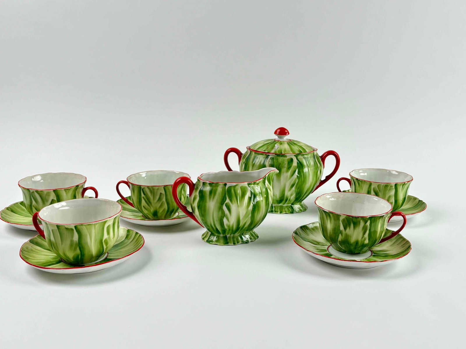 P.A.L.T Czechoslovakian Tea Service: Partial P.A.L.T Czechoslovakian tea service. Includes a cream and lidded sugar bowl with 5 cups and saucers. Good vintage condition. Please see photos for additional details. Dimensions Saucer: 5.5