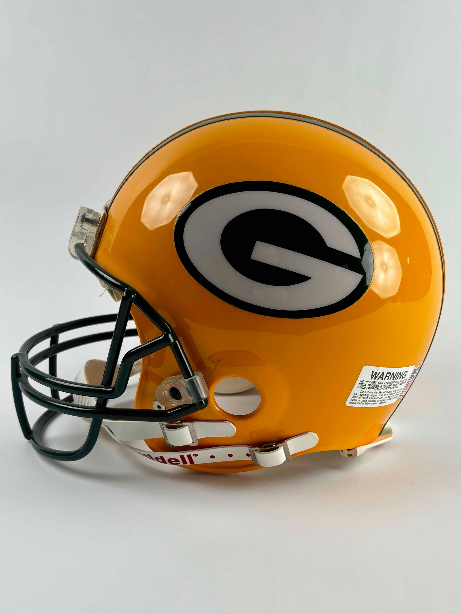 Green Bay Packers Full Size Helmet (Riddell): Green Bay Packers full size football helmet by Riddell. Excellent condition with one scuff as pictured. Appears to have been a used in a game. From the home of a prominent collector in Michigan. Pleas
