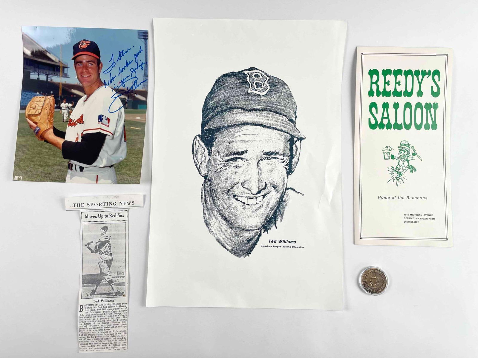 Assorted Baseball Memorabilia (Signed Jim Palmer Photograph, Ted Williams poster, and more): Assorted baseball memorabilia including a signed Jim Palmer photograph, Ted Williams poster, newspaper cutout, State of Michigan Sports Hall of Fame coin, and a Reedy's Saloon program. Items are in ex