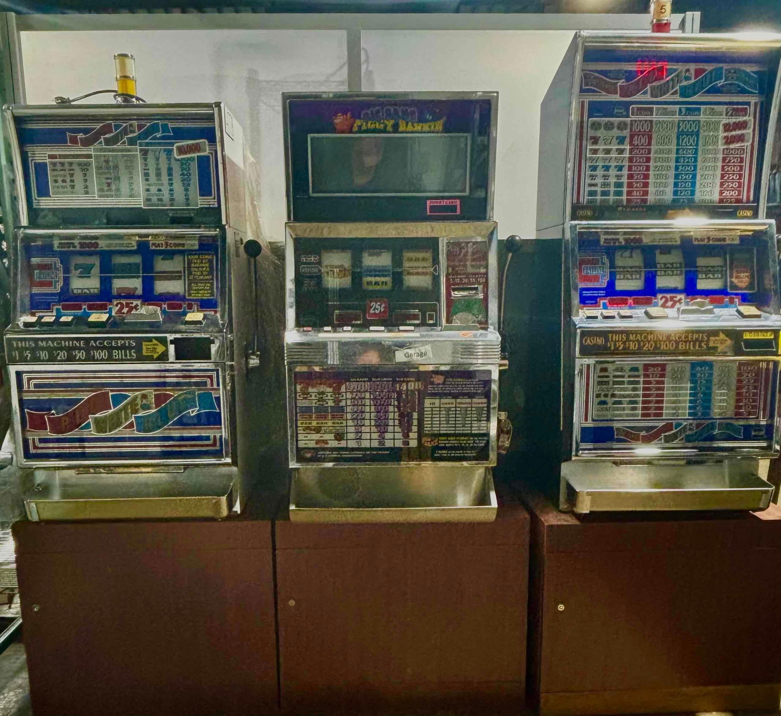 Three Modern Slot Machines on Wood Stands (1 of 20)