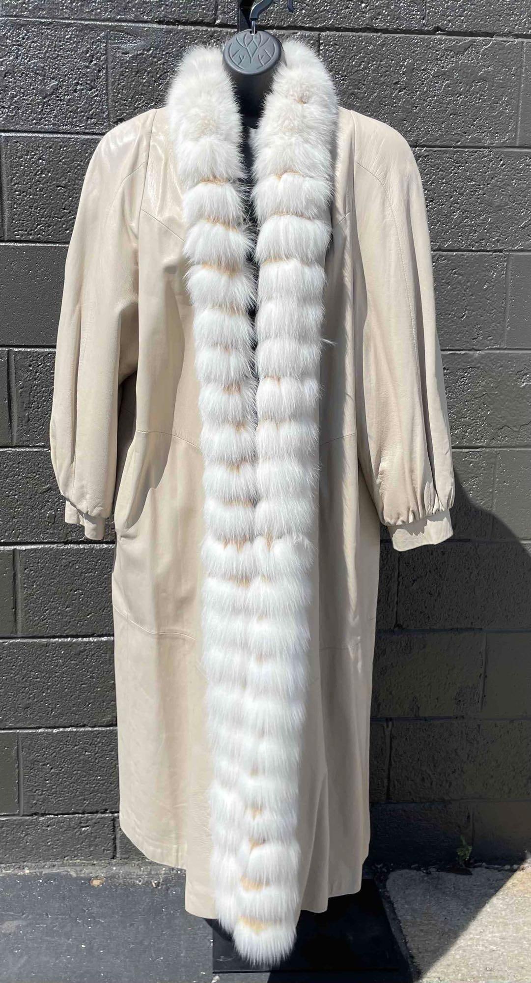 Chinchilla Fur Trimmed Collar Leather Coat (Laura Winston): Chinchilla fur trimmed,cream leather coat by Laura Winston. Coat has button closure. Coat is in good vintage condition with signs of wear such as discoloration on cuff and area on back of waist. Pleas