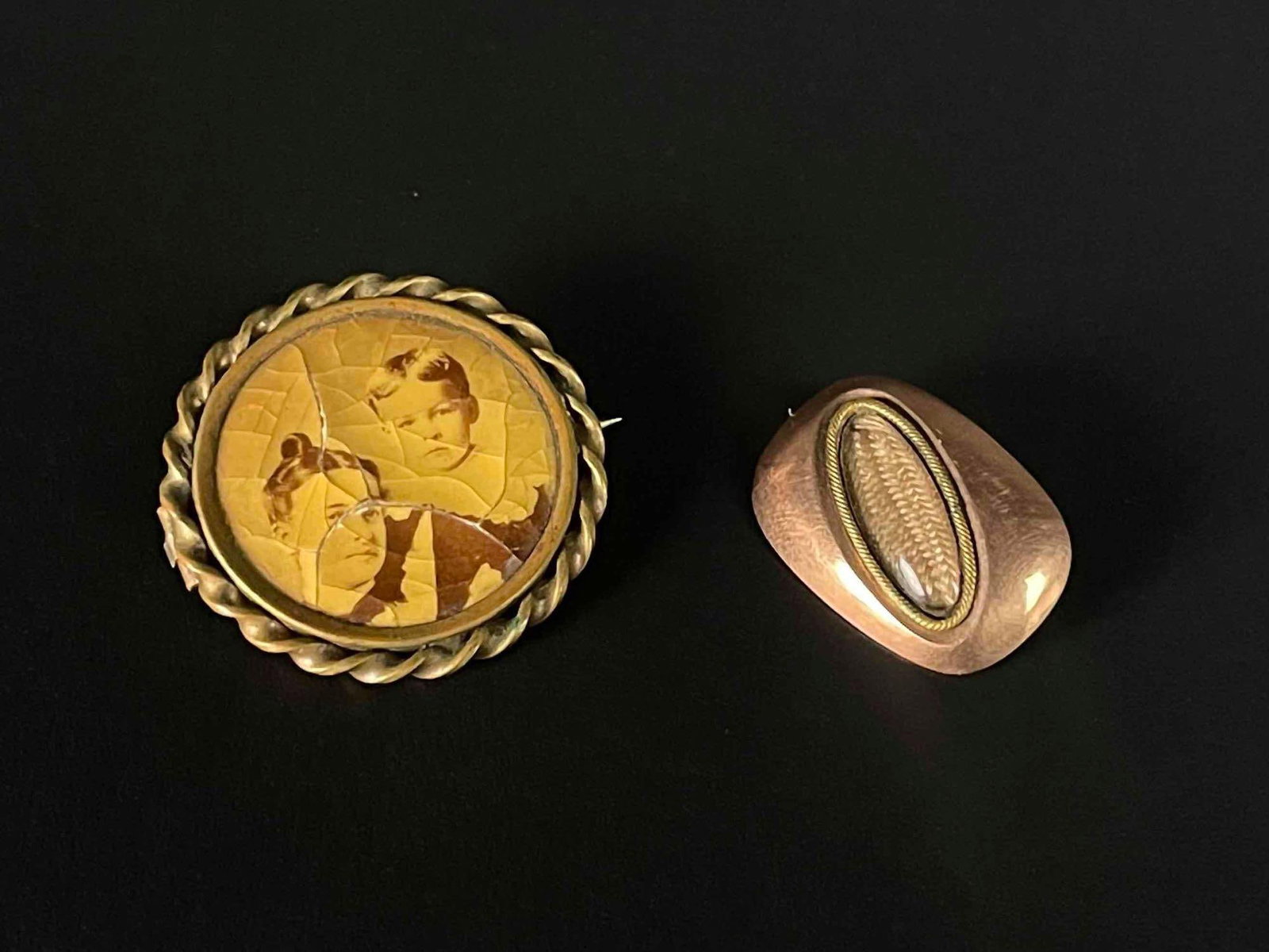 Victorian Mourning Jewelry: A pair of Victorian era mourning jewelry. Includes one pin with cameo, and one pin with a braided lock of hair. In good antique condition with signs of wear that are consistent with age and use. Pleas