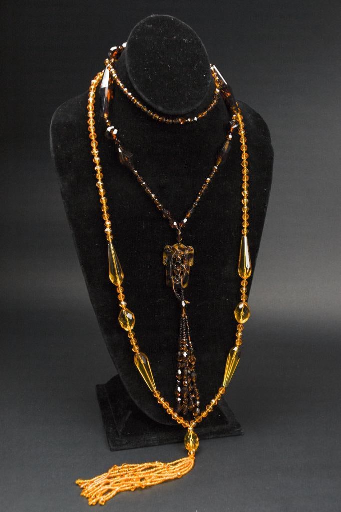 Pai of Art Deco Beaded Tassel Necklace: Two art deco beaded tassel necklaces and pendent. Tortoise and amber toned. Necklaces can be worn loose or wrapped. In excellent condition. Please see photos for additional details. Dimensions: 22" x