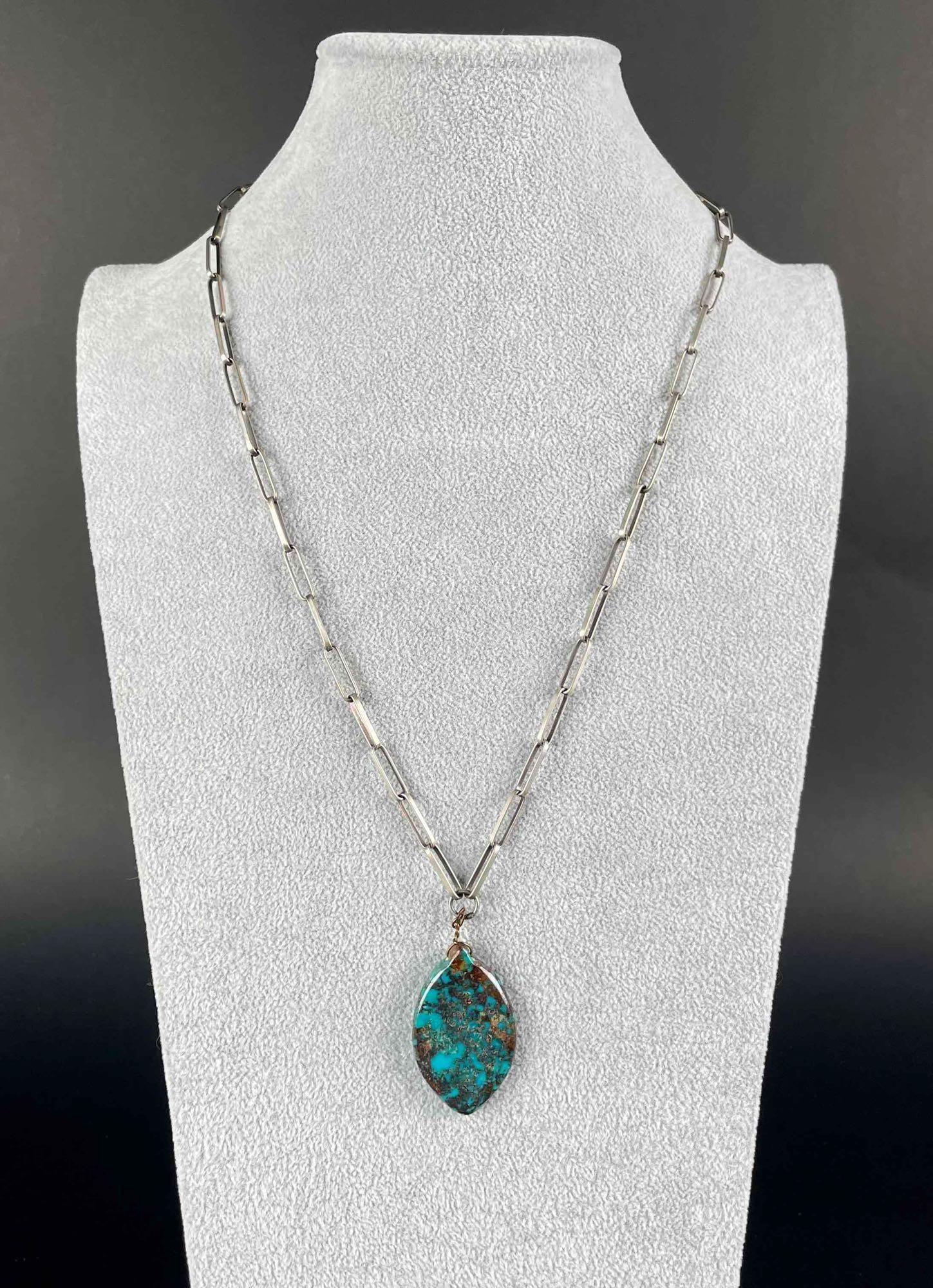 Natural Turquoise Sterling Silver Pendant Necklace: Natural turquoise pendant necklace with sterling silver chain. Chain has a hook and eye clasp. In excellent condition. Please see photos for additional details. Dimensions Pendent: 2" x 1' Dimensions 
