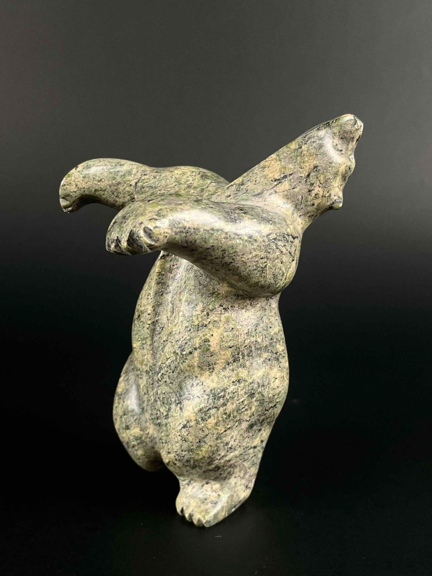 Inuit Dancing Bear (Booku, Cape Dorset/Kinngait): Inuit soapstone bear carving. Signed Booku on foot. Body is polished stone. Piece is signed in Inuktitut syllabics and English on the foot. This piece was purchased directly from the artist by collect