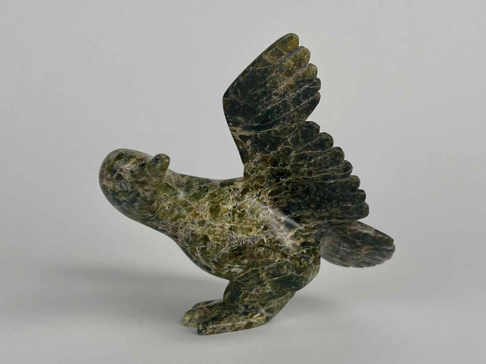 Inuit Carved Duck Sculpture (Cape Dorset/Kinngait): Inuit duck carving. Body is polished stone. Artist is unknown. This piece was purchased in Cape Dorset/Kinngait, directly from the artist by collector Jon Jacobs, a prominent collector of Inuit art. P