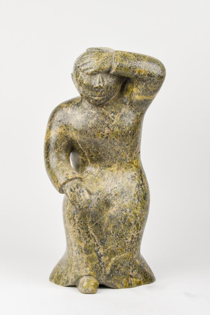 Large Inuit Figural Sculpture (Qavaroak Tunnillie, Cape Dorset/Kinngait): Inuit soapstone sculpture depicting woman. Polished soapstone. Piece is signed in Inuktituk syllabic to underside. This piece was purchased directly from the artist in Cape Dorset/Kinngait by collecto