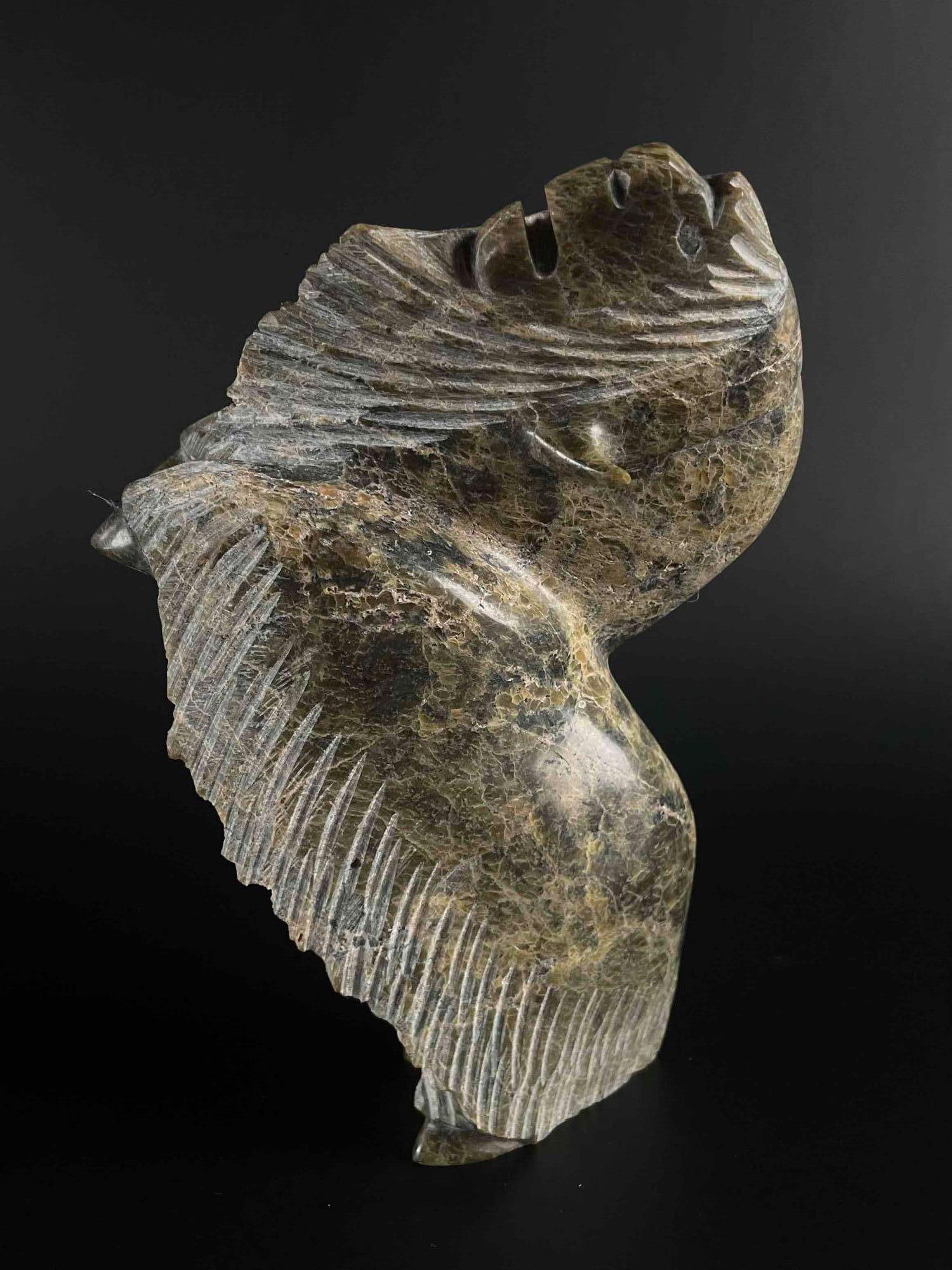 Inuit Carved Musk Ox (Cape Dorset/Kinngait): Green soapstone of Inuit musk ox rearing up. Body is polished stone. This piece is signed in Inuktitut syllabics to underfoot. This piece was purchased in Cape Dorset/Kinngait, directly from the artis