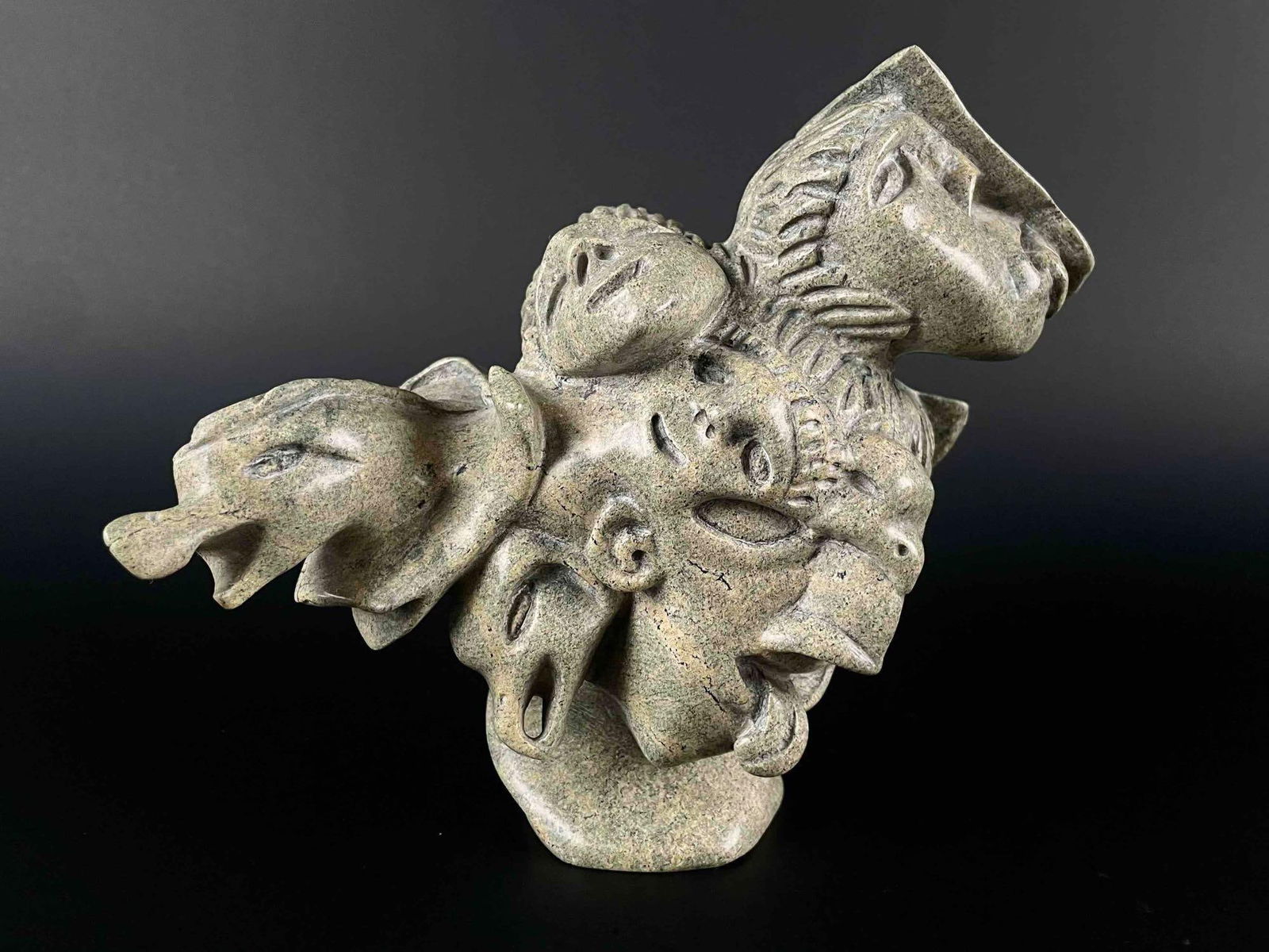 Inuit Spirit Carving (Tytootsie Tunnillie, Cape Dorset/Kinngait): Green soapstone Inuit spirit carving. This piece is signed in Inuktitut syllabics to underside. Artist Tytootsie Tunnille. Numbered (5411, 68) This piece was purchased in Cape Dorset/Kinngait, directl