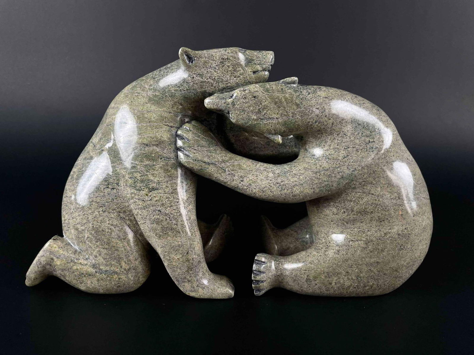 Extra Large Tandem Bear Inuit Sculpture (Ohito Ashoona, Cape Dorset/Kinngait): Tandem bear inuit carving signed Ohito Ashoona. This piece is made from green soapstone and is signed in English to underside. (Ohito Ashoona, Cape Dorste Kinngait) (5066, 27) High polished stone. No