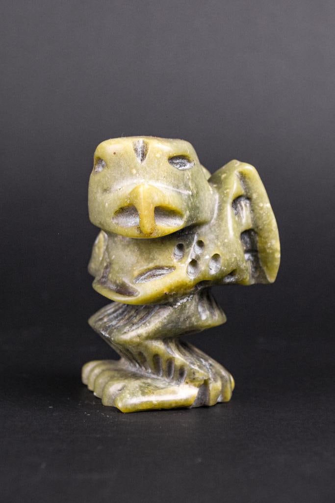 Inuit Spirit Carving (Tytoosie Tunnille, Cape Dorset/Kinngait): Inuit spirit carving. This piece is made from green serpentine and is signed in Inuitituk syllabic to underside. (Tytoosie Tunnille, Cape Dorste Kinngait) No chips, scratches, or cracks. This piece wa