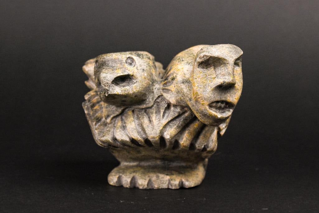 Inuit Spirit Carving (Tytoosie Tunnille, Cape Dorset/Kinngait): Inuit spirit carving by Tytoosie Tunnille. This piece is made from green soapstone and is signed in Inuktituk syllabic to underside and dated 1991. No chips, scratches, or cracks. This piece was purch