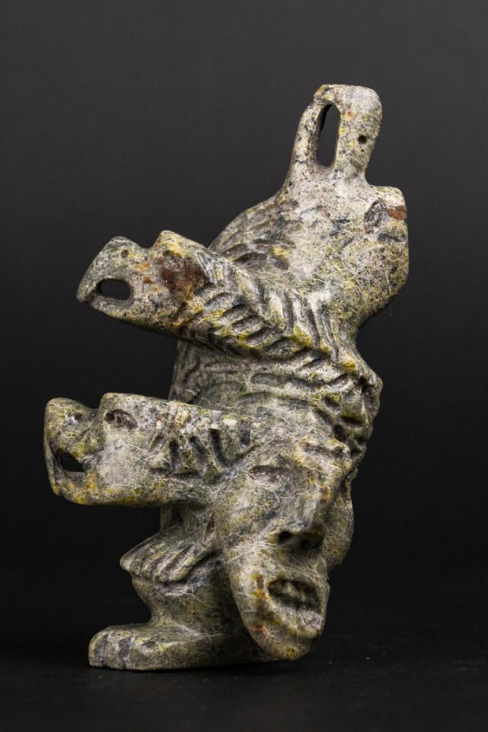 Inuit Spirit Carving in Green Soapstone (Tytoosie Tunnillie, Cape Dorset/Kinngait): Inuit Soapstone abstract spirit carving. Polished green soapstone. Piece is signed in Inuktitut syllabics on the foot. Signed Tyootsie Tunnille. This piece was purchased in Kinngait/Cape Dorset, direc