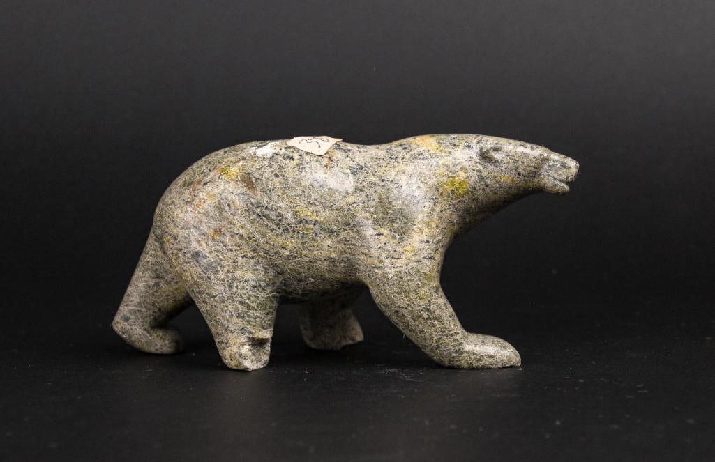 Inuit Soapstone Bear (Cape Dorset/Kinngait): Inuit soapstone bear carving. Polished green soapstone. Piece is signed in Inuktitut syllabics on the foot. This piece was purchased directly from the artist in Cape Dorset/Kinngait by collector Jon J