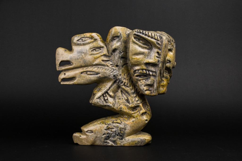 Large Inuit Spirit Carving in Soapstone (Tytoosie Tunnillie, Cape Dorset/Kinngait): Abstract Inuit spirit carving by Tyootsie Tunnille. Polished soapstone. Piece is signed in Inuktituk syllabics on the foot. This piece was purchased directly from the artist in Cape Dorset/Kinngait by