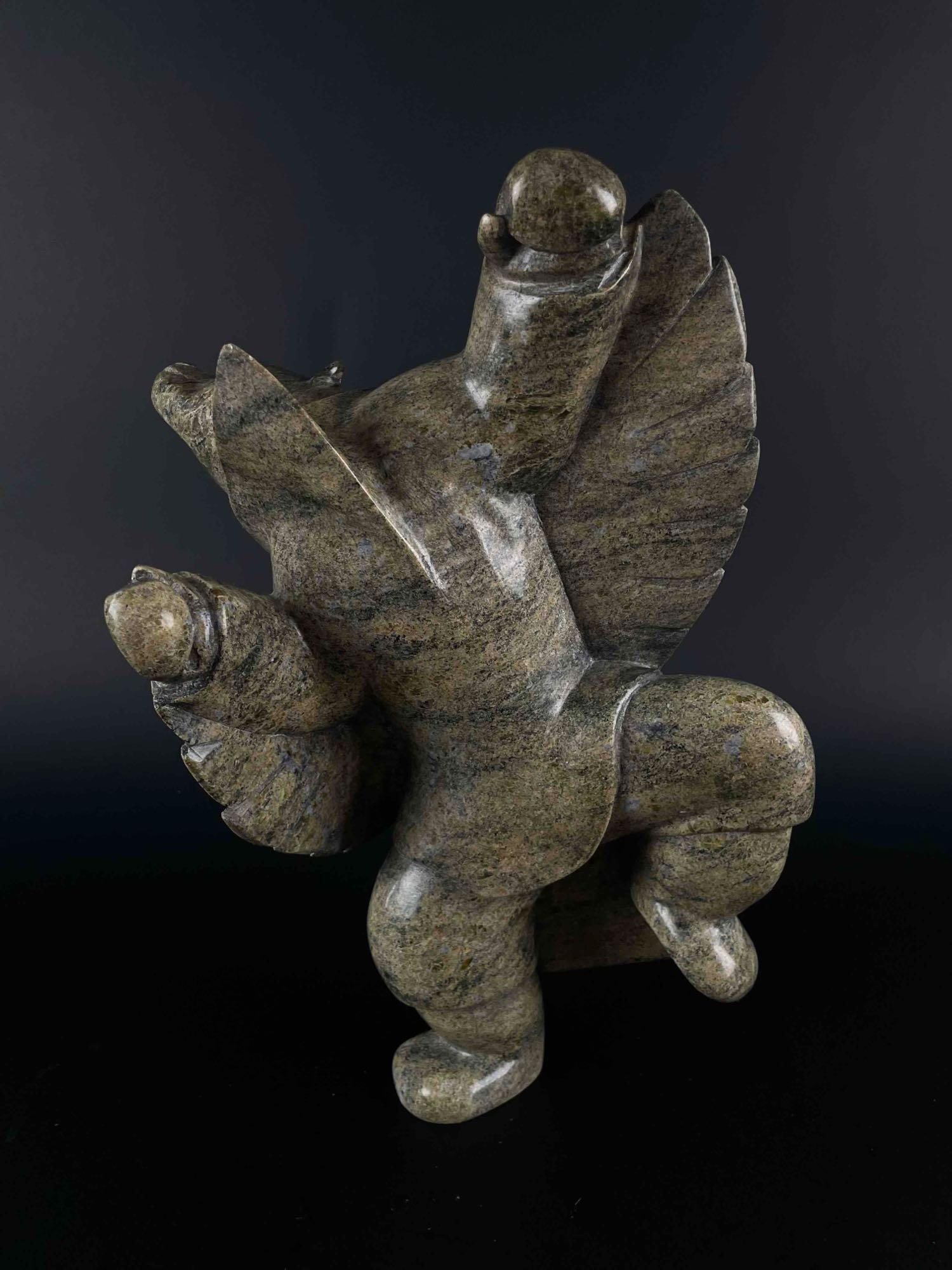 Inuit Dancing Spirit Bear Carving (Cape Dorset, Kinngait): Inuit Dancing Bear sculpture. Polished soapstone. Piece is signed in Inuktituk syllabics on the foot. This piece was purchased directly from the artist in Cape Dorset/Kinngait by collector Jon Jacobs,