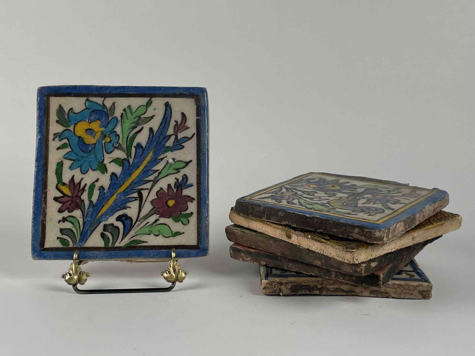 Six Hand Painted Floral Ceramic Tiles with Birds: Total of 6 hand painted ceramic tiles with floral and bird designs. Each tile is in good condition and may have signs of wear that are consistent with age and use such as surface cracking or chipping