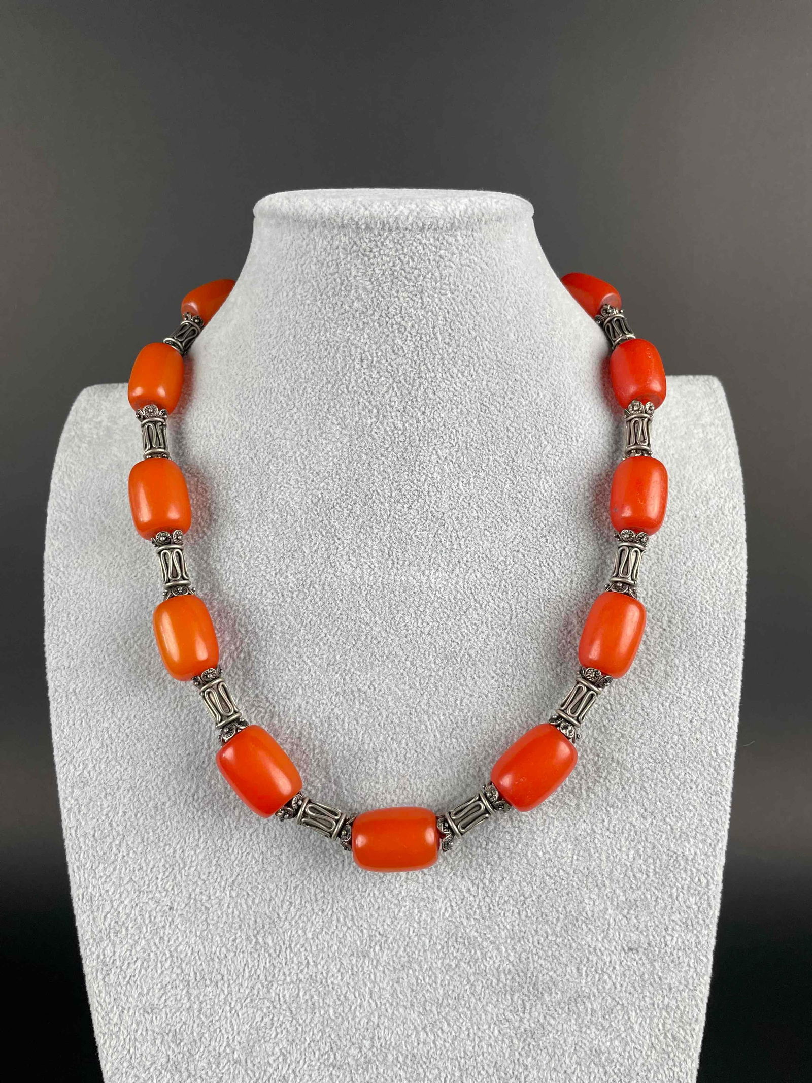 Orange Bakelite Beaded Necklace: Orange bakelite beaded necklace with silver toned spacers. Necklace has a lobster clasp. In excellent condition. Please see photos for additional details. Length: 21" Weight: 89.77 g Please note