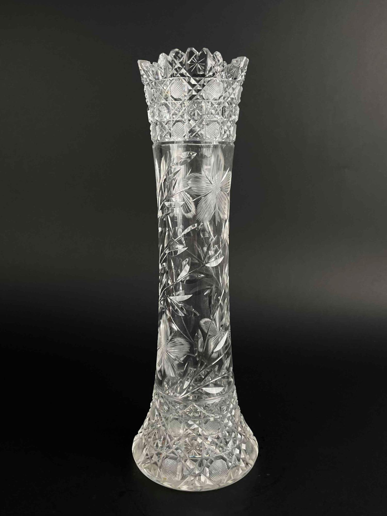 Brilliant Cut Flower Glass Vase: Brilliant cut glass vase for holding flowers. Features a sawtooth design rim and engraved floral pattern. From the home of Jon Jacobs, a prominent collector from Michigan. Vase is in good condition wi