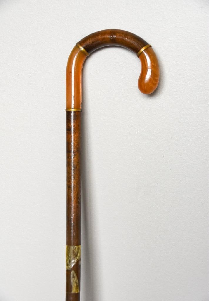 Antique Carved Horn Segmented Walking Stick: Antique walking stick crook cane with horn segments and brass hardware. Brass bands trim the horns. Cane is taped as pictured. Brass tip is missing. Please see photos for additional details. Dimension
