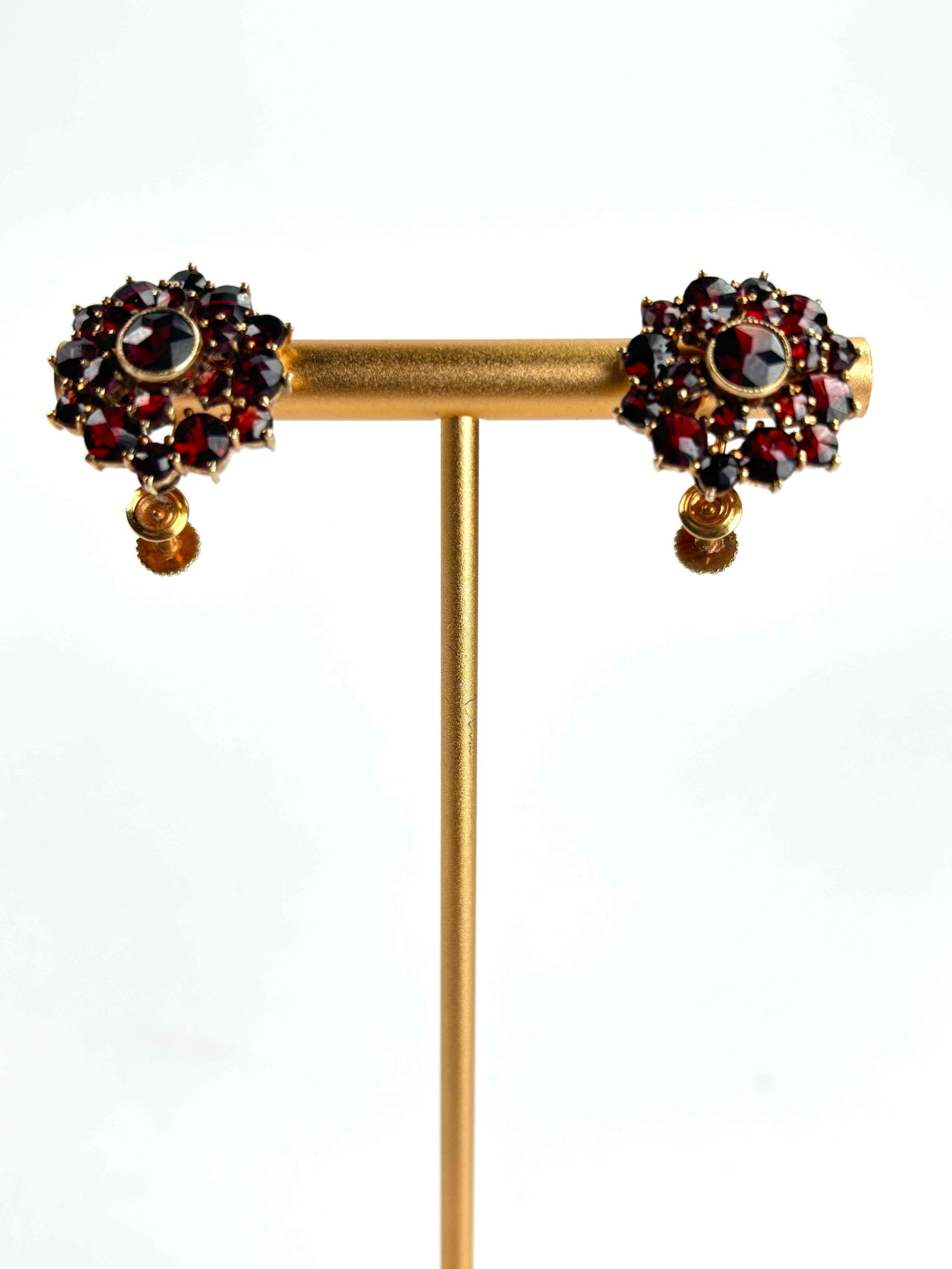 Estate 14k Gold and Garnet Clip Earrings: Vintage Garnet and 14k gold clip earrings. 14K hallmark is on the post and visible with a loop. The earrings have been gold tested and are in good vintage condition. Please see the photos for addition