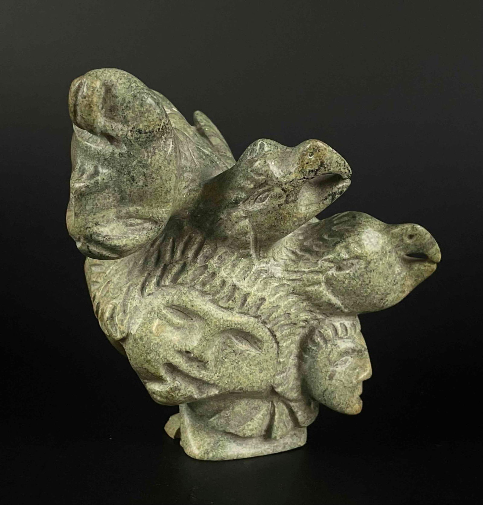 Green Soapstone Inuit Spirit Sculpture (Tytoosie Tunnillie, Cape Dorset/Kinngait): Green soapstone Inuit Sculpture. Signed in Inuit on the foot along with "T.T." (Tyootsie Tunnille) This piece was purchased by collector Jon Jacobs in Cape Dorset/Kinngait in the 1970s. Piece is in go