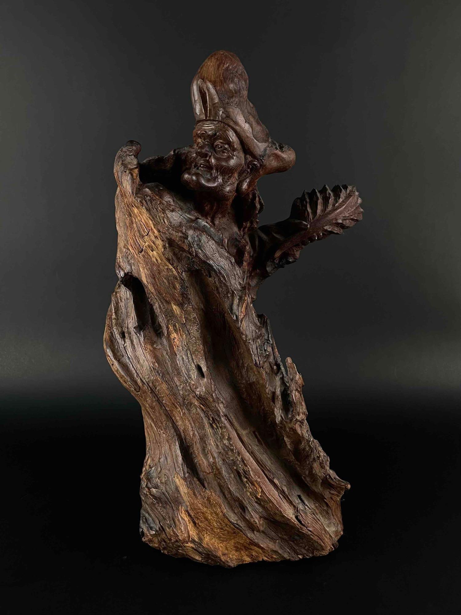 Chinese Carved Burlwood Deity Sculpture: Carved Burlwood sculpture of a Chinese Deity. Sculpture is in excellent condition. Please see photos for additional details. Purchased in Hong Kong by John Jacobs, a prominent collector in Michigan. D