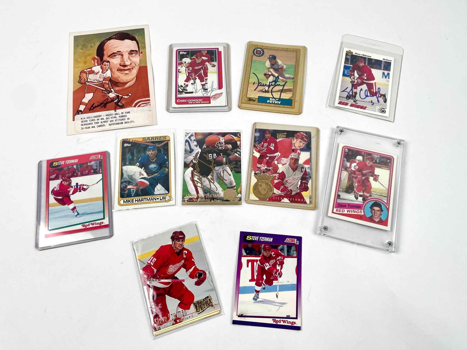 Signed Sports Trading and Steve Yzerman Cards: Assorted training cards from various professional teams. Some cards are signed. Please see photos for additional details. Cards include but are not limited to: Steve Yzerman Bill Gadsby Mike Hartman C