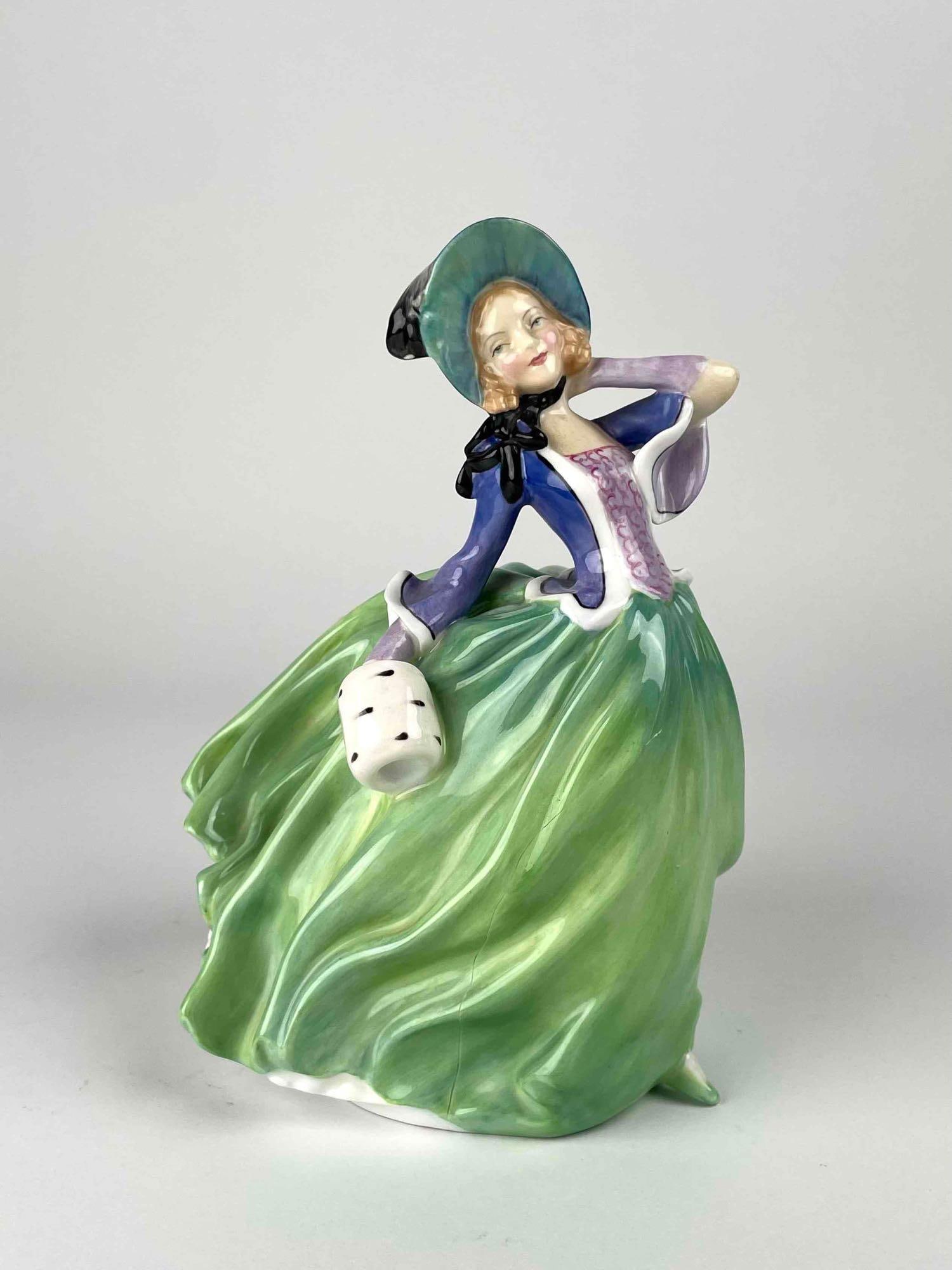 Royal Doulton "Autumn Breezes" Figurine: Royal Doulton figurine titled "Autumn Breezes." Hallmark is located on bottom of figurine. In good condition. Figuring has a crack on skirt region. Please see photos for additional details. Please not