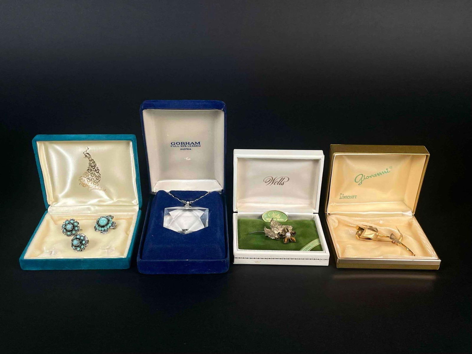 Lot of Vintage Jewelry in Original Boxes (Giovanni, Wells, Gorham): Assorted costume jewelry in original boxes. Three brooches and a pair of clip on earrings. All pieces are in excellent vintage condition. Please see photos for additional details. Please note all lots