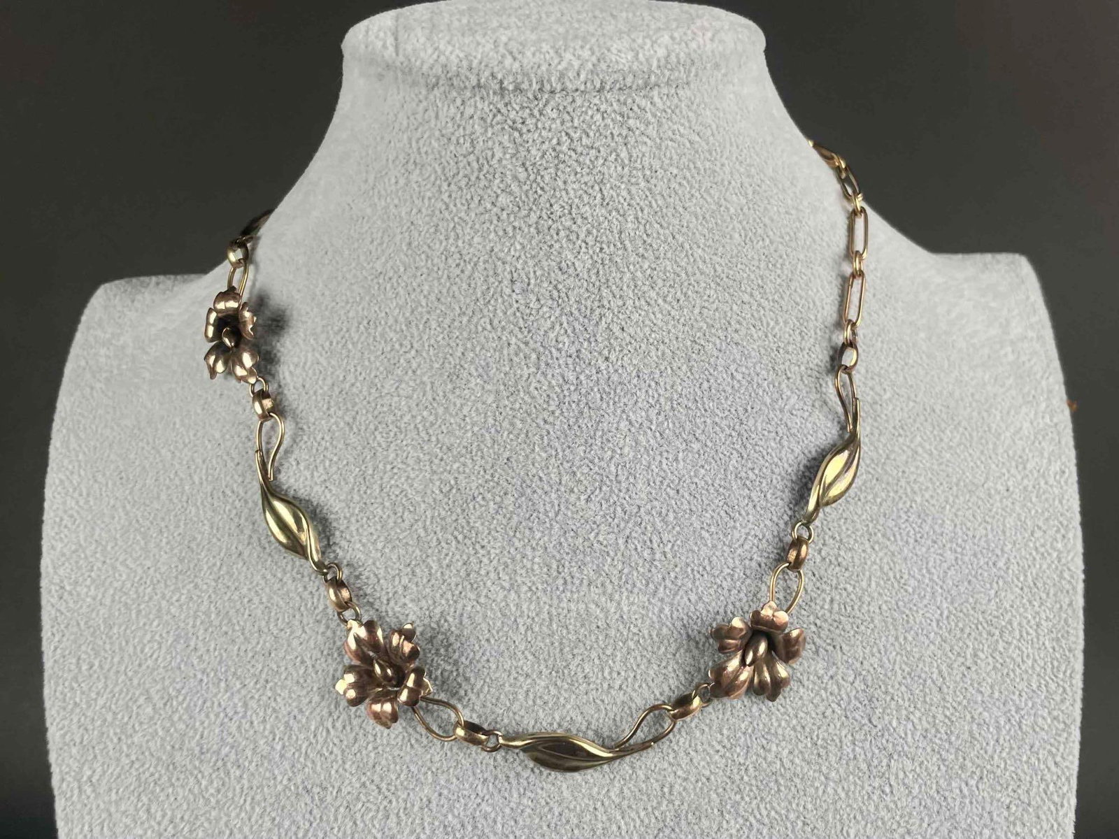 Gold Plated Floral Choker Necklace (Pat'D): Antique gold plated choker necklace with floral design. Gold trademark is located on spring ring clasp. Design Pat'D is incised on back of flower petal. Necklace is in excellent estate condition. Plea