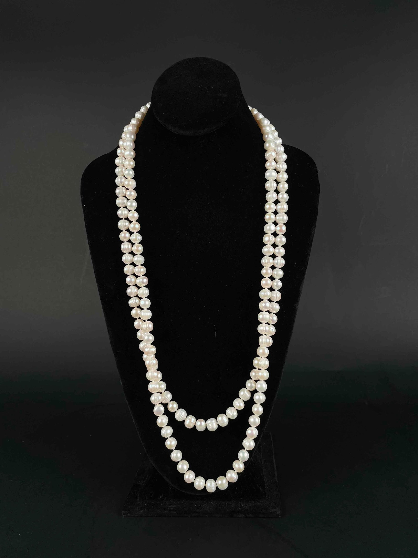 Baroque Pearl Necklace: Baroque pearl necklace. Pearls are hand knotted with white string. In excellent condition. Please see photos for additional details. Dimensions: 61" around Weight in Box: 219 g Please note all lots sh