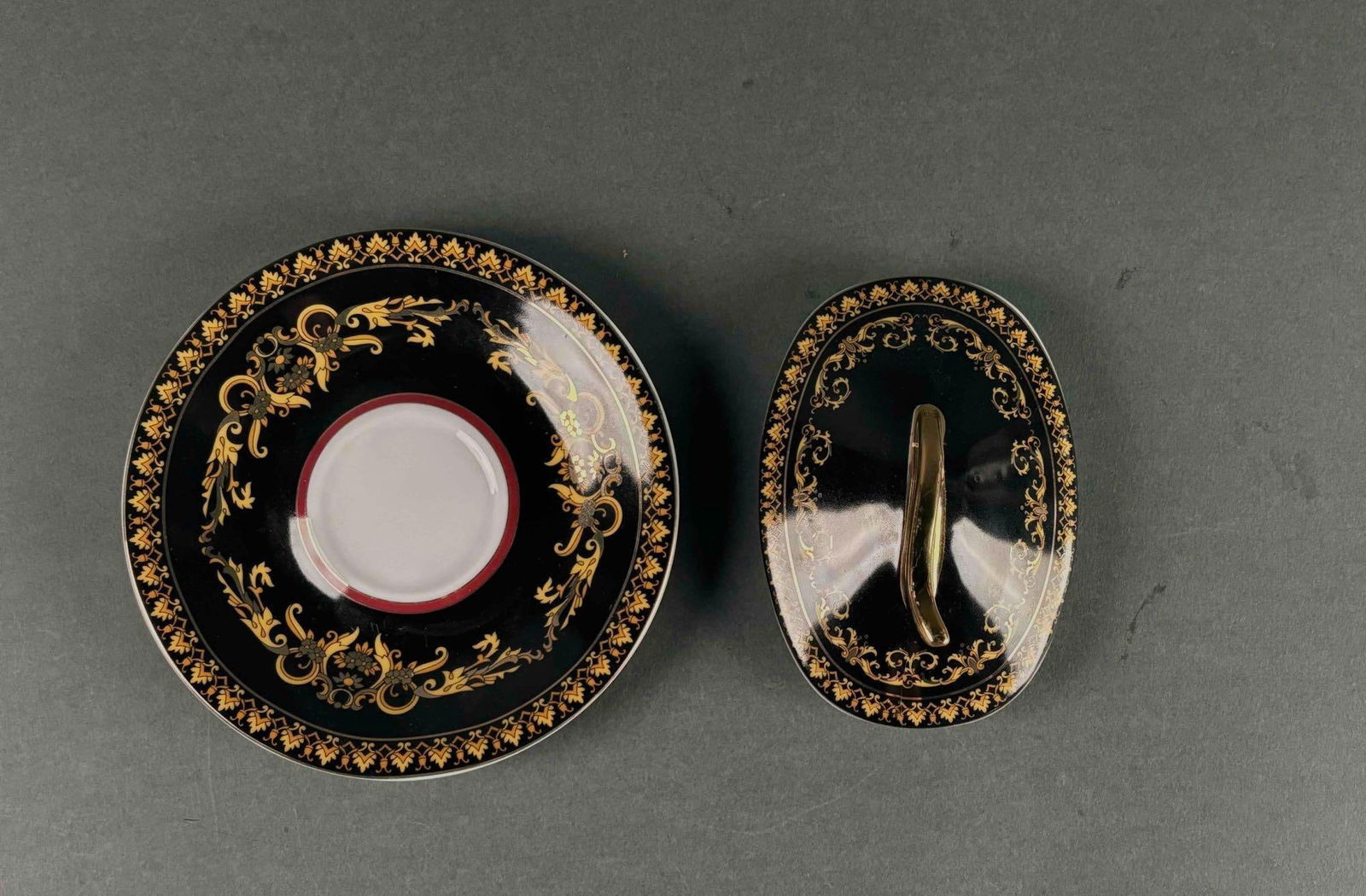 Versace by Rosenthal "Medusa": Two replacement pieces of Versace "Medusa" by Rosenthal china. The lot includes a sugar lid and tea saucer. Hallmarks are present as pictured. Excellnet condition. Please see the photos for additional