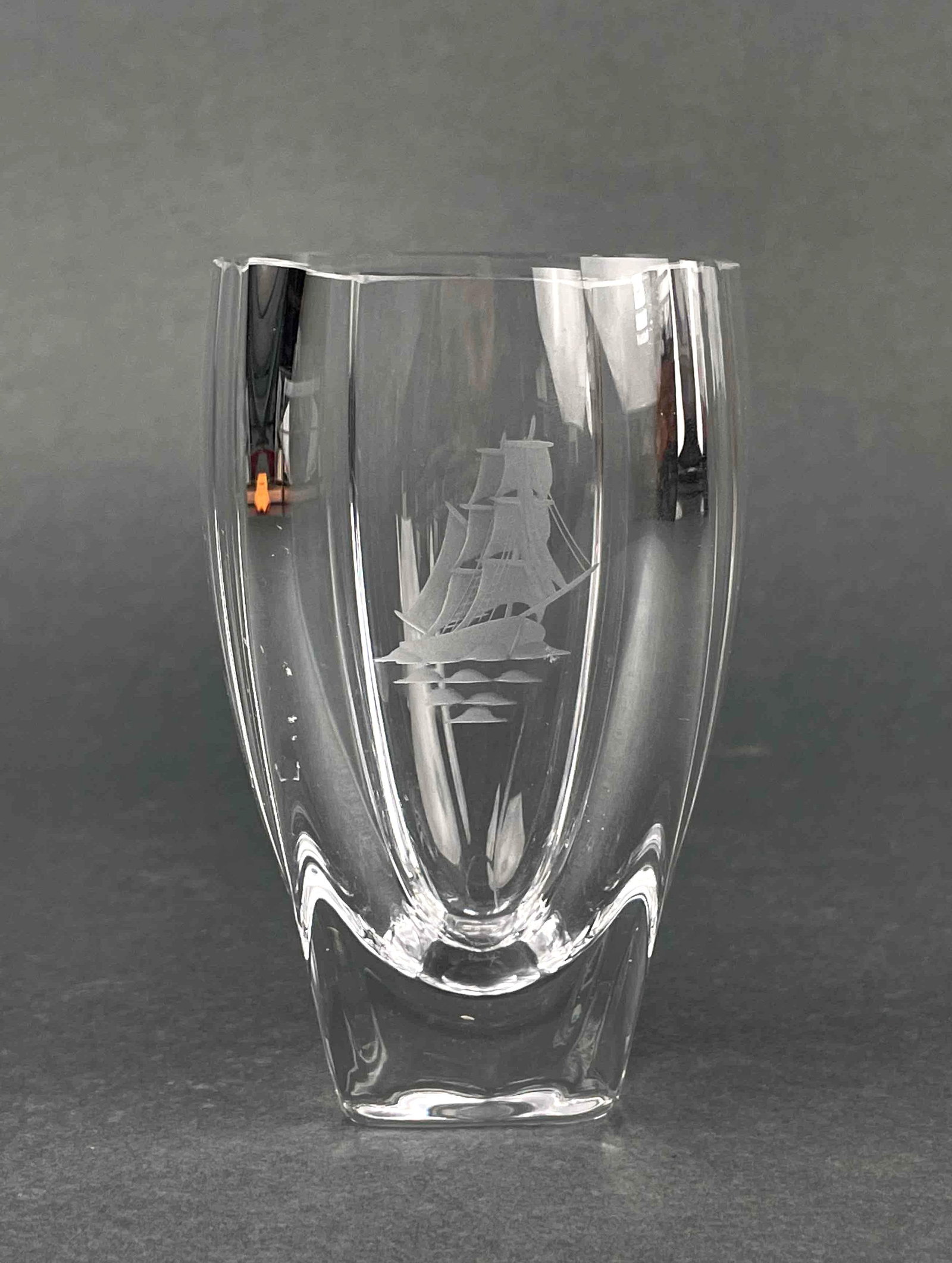Signed Sailboat Etched Glass Cup (Orrefors Sweden): Signed etched glass cup with sailboat design by Orrefors. Signature is engraved on bottom of cup. In excellent condition. Please see photos for additional details. Dimensions: 3" x 3" x 4.75" Weight: 