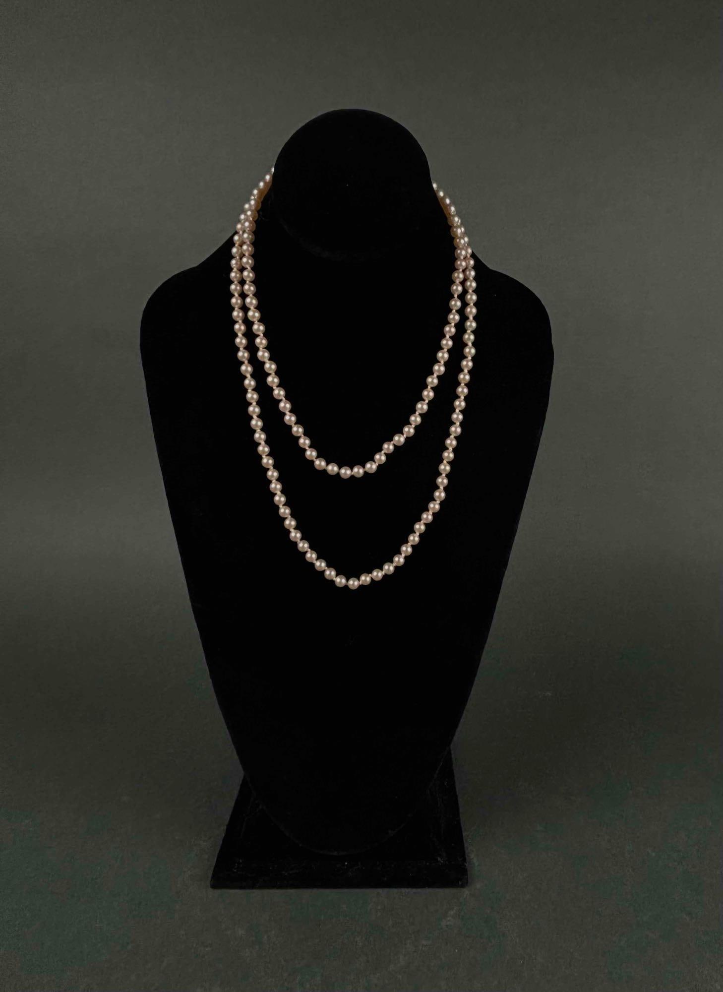 Antique Cultured Double Strand Pearls: Antique cultured pearls with art deco sterling silver box clasp. Pearls are hand knotted. Double Strand. Sterling hallmark embossed on the clasp. Good antique condition. Please see photos for addition